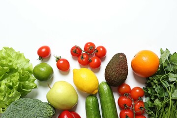 Clean healthy eating habits concept. Fruits, herbs, greens and vegetables mix, colorful juicy organic detox smoothie juice ingredients. Vegan vegetarian diet food