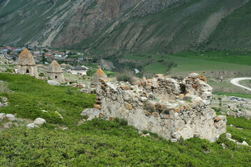 Medieval stone burial grounds of Fardyk-Keshene on slope near the village of Eltyuby and Bulungu in Chegem gorge. North Caucasus, Kabardino-Balkaria, Russia. Tourism, remote location.