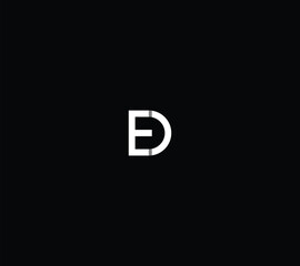 Letter ED or DU monogram with black background. 