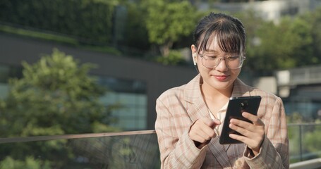 Asian teenage woman using smartphone to shop online. Women make financial transactions, transfer money via bank apps, order products. Businesswoman chatting on mobile phone. communication technology