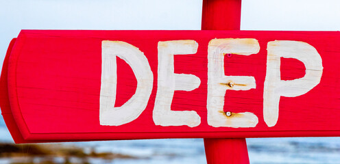 Red pink direction and information signs for massage and therapies.