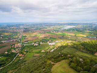 Fototapeta premium Italy, Campania, Paestum, Piana del Sele, aerial view of the Sele plain with its cultivated lands looking at the sea