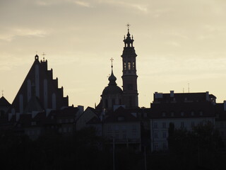 Silhouettes of City Architecture at Sunset with Church Spires and Buildings