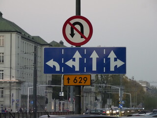 No Left Turn and Directional Road Sign at Urban Intersection 629