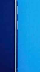 Fototapeta premium Minimalist Smartphone Edge Against Dual-Tone Blue Background