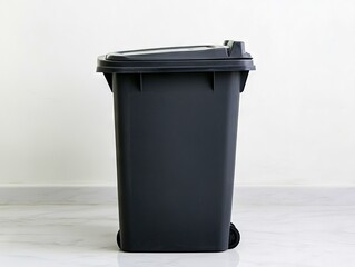 A black trash can sitting on top of a white floor