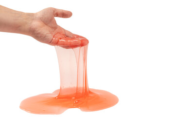 Red slime toy in man hand isolated on white.