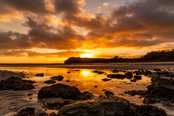 Sunset at Trearddur Bay with a lifeboat returning 