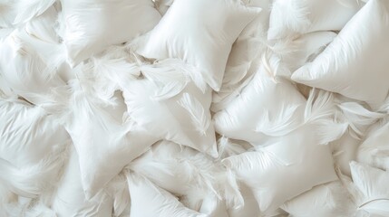 Fototapeta premium A multitude of white pillows creates a backdrop filled with disorganized feather cushions