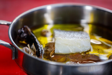 A preparation of olive oil with red pepper and garlic