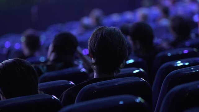  People Listening Speaker and Discussing Information in Large Halle