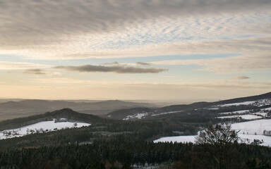 The ruins of Kumburk Castle offer a breathtaking view of the Czech landscape, blanketed in snow.