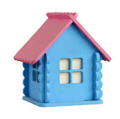 Small wooden house toy with pink roof isolated on white background. Colorful miniature wooden house representing the concept of home, family, real estate, or construction