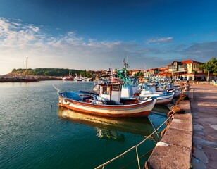 Fishing net and moored fishing boats at the port 