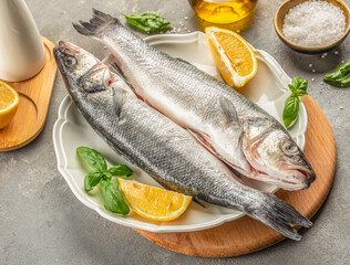 raw fish sea bass for cooking. banner, menu, recipe top view