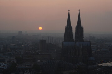 Naklejka premium Sunset with two high church towers. 