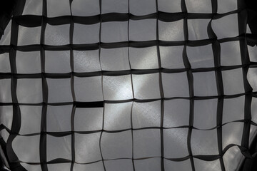 Softbox interior. Abstract textured background with intersecting monochrome geometric shapes and lighting effects