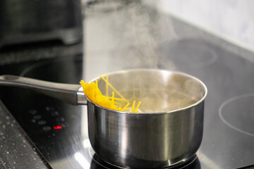 Cooking Spaghetti Pasta on a Stove. Cooking food in the kitchen