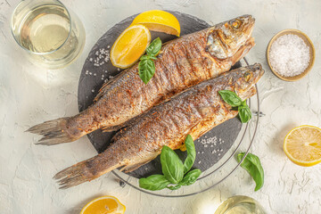 Baked sea Bass fish, grilled seabass with white wine. banner, menu, recipe place for text, top view