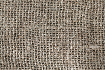 Close up background, natural craft brown linen fabric, thread weave, textile texture, perfect for backgrounds, textiles, wallpapers