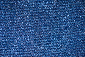 Navy blue color textured surface. Dark textile texture. Indigo color abstract grunge background