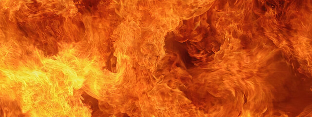 Bright, swirling flames illuminate the dark area, creating a mesmerizing yet dangerous spectacle of fire. The heat radiates, emphasizing the ferocity of the blaze