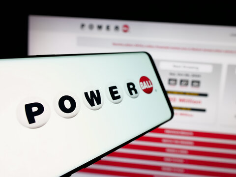 Stuttgart, Germany - 10-24-2024: Cellphone with logo of US lottery game Powerball on screen in front of website. Focus on center-left of phone display.