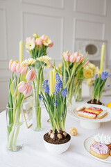 Bright and Fresh Spring Table Decor with Hyacinths, Tulips, Candles and Desserts 