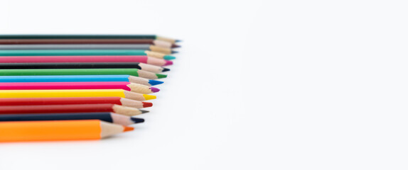 multicolored pencils on a white background with a place to copy