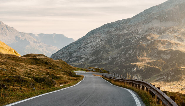 Empty Spl&uuml;gen Pass at sunset. Diminishing perspective view of alpine mountain pass of the Lepontine Alps connecting Italy and Switzerland.