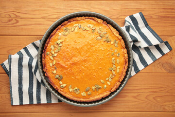 American Pumpkin Pie for autumn holiday on wooden background. Happy Thanksgiving Day. Top view