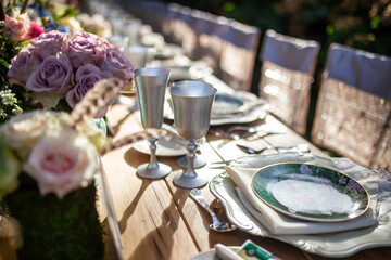 Romantic Outdoor Banquet with Floral Canopy and Chandeliers