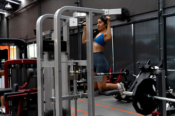 Smart woman is using a machine to exercise  use Exercise machines