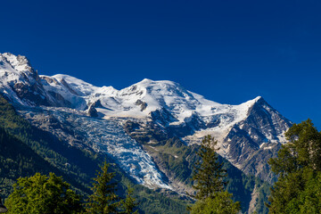 Mont Blanc, Monte Bianco mountain summit snow dome above the Chamonix valley in France. Highest peak in Europe in the Alps, alpice scenic view of Montblanc