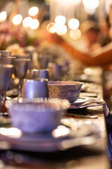 Elegant Dinner Setting with Silverware and Soft Candlelight