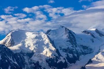 Mont Blanc, Monte Bianco mountain summit snow dome above the Chamonix valley in France. Highest peak in Europe in the Alps, alpice scenic view of Montblanc