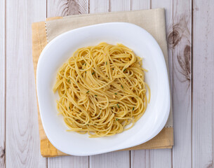 Spaghetti pasta in a plate with garlic and olive oil