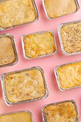 Various pies viewed from above on full pink background © André Polvani