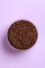 Brigadeiro cake seen from above on a lilac background