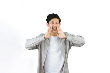 Young Teenager in shirt and vest gives expression of happiness and sadness points with gestures with hands