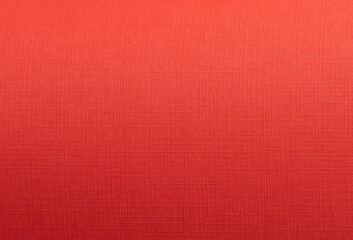 Soft fabric background in a rich red hue, showcasing a seamless, closeup texture with a silky,