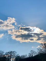 The sky with clouds, the sun behind the clouds, spring, summer, nature