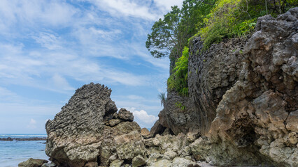 Beach Caves, 'Playa Cuevas' in Costa Rica near Mal Pais and Santa Teresa. Rocky side with Costa Rica flag.