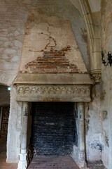 Abandoned fireplace in an old castle room