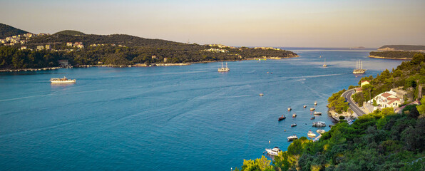 Dubrovnik Peninsula with houses, roads, sea view, and boats