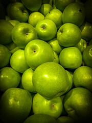 Vivid colors of autumn in food produce - green apples.