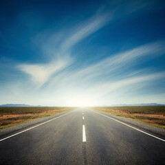 Fototapeta premium a straight road stretching into the horizon across a deserted land cloudy weather