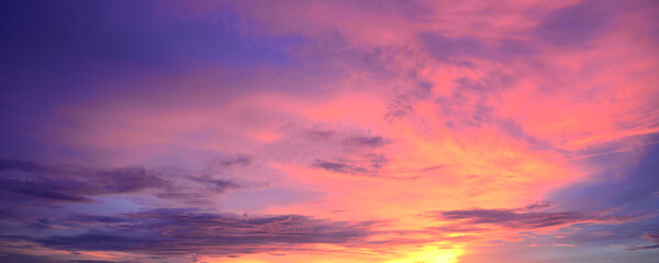 Banner purple sky sunrise dramatic beautiful landscape view. Dawn sky violet pink gold dusk time cloudscape with sunlight. Panorama Dramatic vibrant sunset scenic landscape nature with copy space