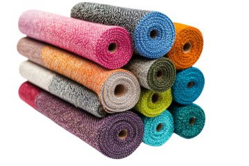 Colorful rolls of fabric stacked together, showcasing various textures and hues, ideal for crafting and design.