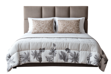 Elegant bed with decorative pillows and floral quilt, perfect for modern bedroom decor.